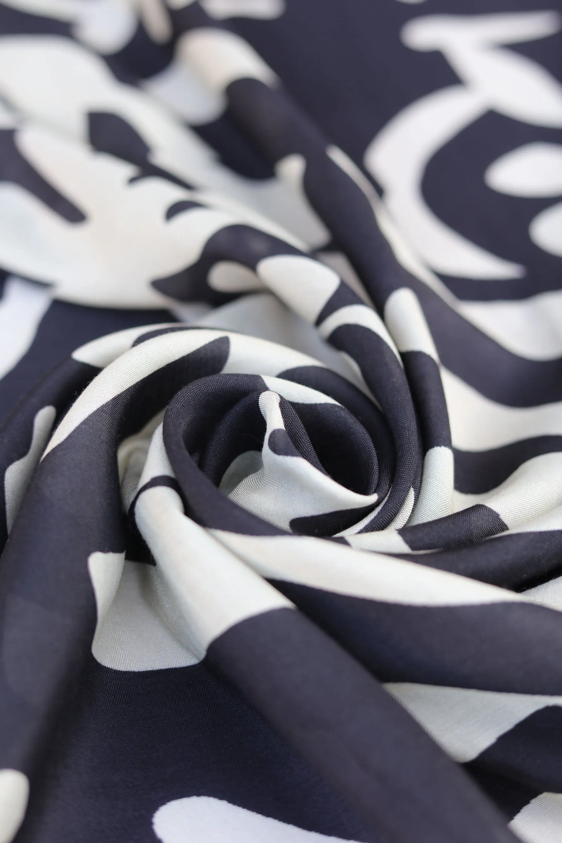 Black and Off White Abstract Pattern Printed Natural Muslin Silk Fabric