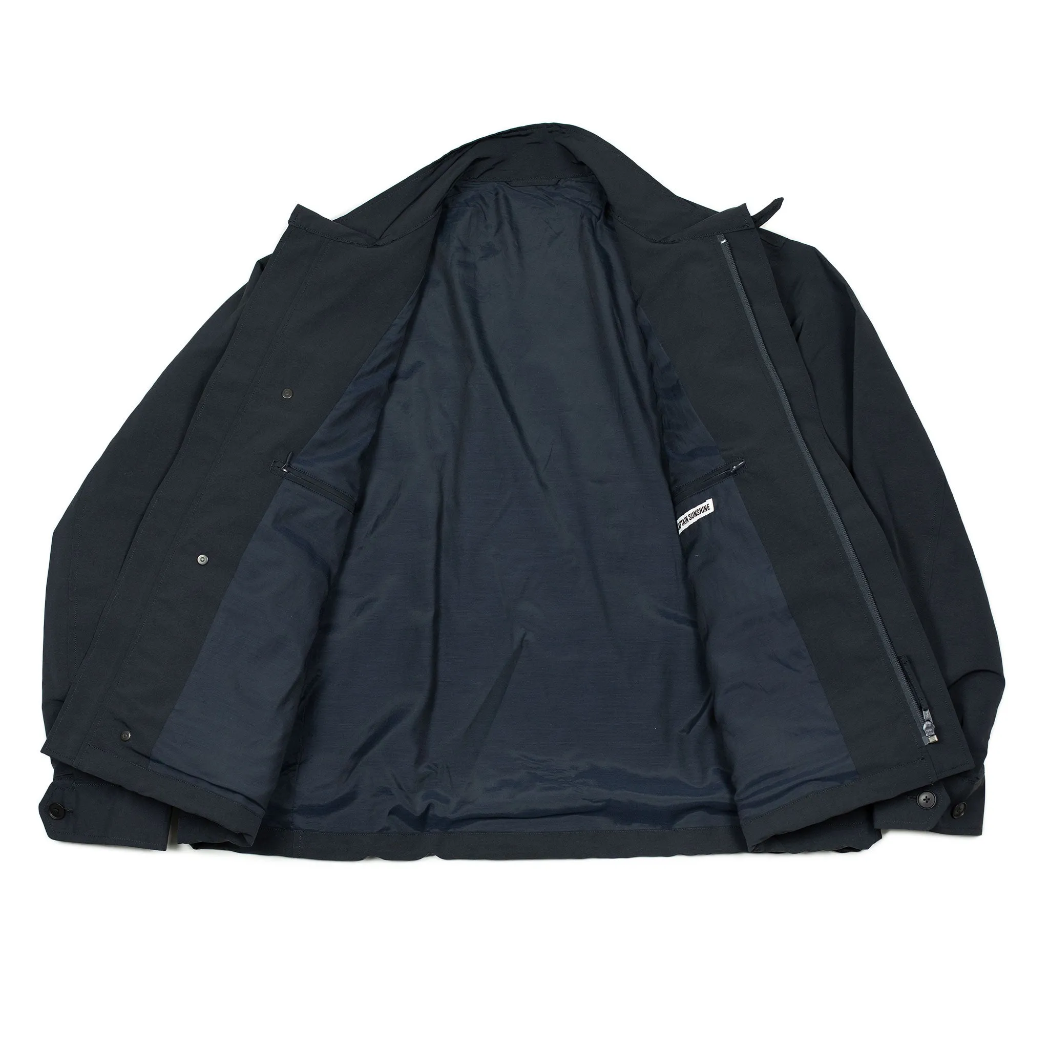 Photographer jacket in navy water-resistant polyester and paper