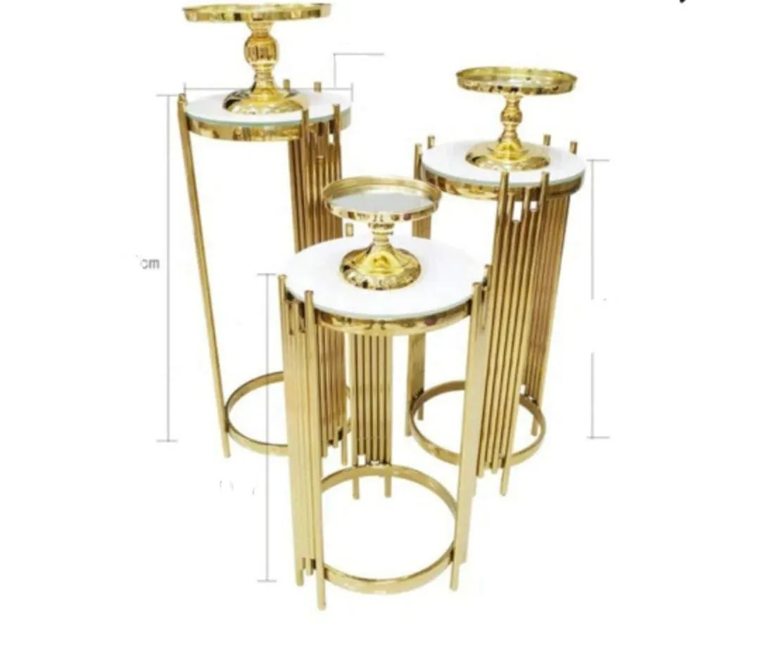 Table round stand (gold plinth) beside Backdrop