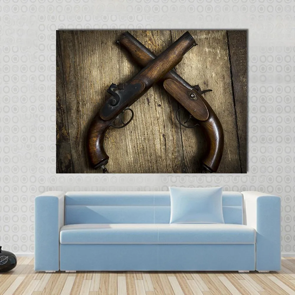 Two Vintage Pistols On Wooden Table Canvas Wall Art