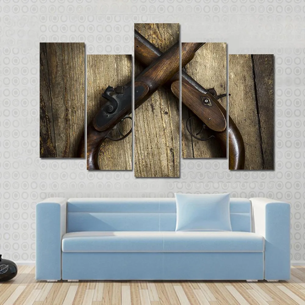 Two Vintage Pistols On Wooden Table Canvas Wall Art